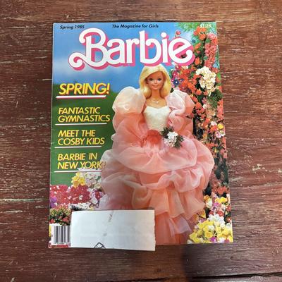 LOT 297: NIP 1998 Happy Holiday Barbie, 1985 Barbie Magazine & 1979 Sunshine Family Coloring Book