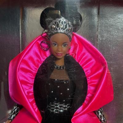 LOT 297: NIP 1998 Happy Holiday Barbie, 1985 Barbie Magazine & 1979 Sunshine Family Coloring Book