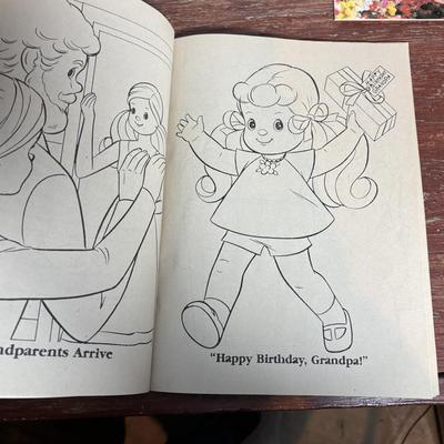 LOT 297: NIP 1998 Happy Holiday Barbie, 1985 Barbie Magazine & 1979 Sunshine Family Coloring Book