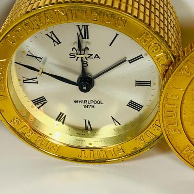 LOT 299: Clocks and Quacks - Brass Duck Book End, Bulova Quartz Mantle Clock, Florin Travel Clock, Swiza Swiss Coin Shaped Alarm Clock...