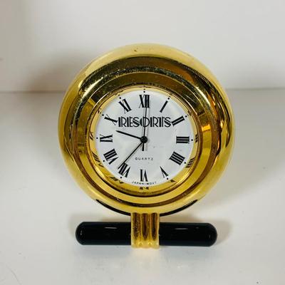 LOT 299: Clocks and Quacks - Brass Duck Book End, Bulova Quartz Mantle Clock, Florin Travel Clock, Swiza Swiss Coin Shaped Alarm Clock...