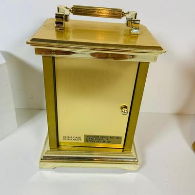 LOT 299: Clocks and Quacks - Brass Duck Book End, Bulova Quartz Mantle Clock, Florin Travel Clock, Swiza Swiss Coin Shaped Alarm Clock...