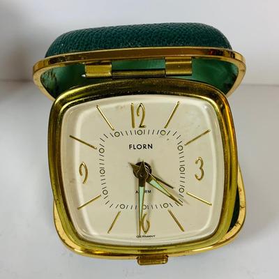 LOT 299: Clocks and Quacks - Brass Duck Book End, Bulova Quartz Mantle Clock, Florin Travel Clock, Swiza Swiss Coin Shaped Alarm Clock...