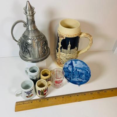 LOT 306: German Mug Metal Decanter, Shot Glasses and More