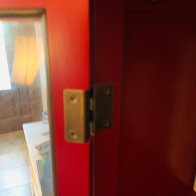 LOT 330: Red Wooden Book Case with Drawer and Glass Front Doors Books, and Book Ends