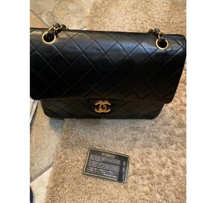 Sale Photo Thumbnail #30: Authentic Chanel double flaps bag in very good condition.  No rips or tears inside out.  Gold hardware in bright shining color.  Some minor wears and creases very good for its age.  Corners are fine.  Authenticity card included, the card has some damages 