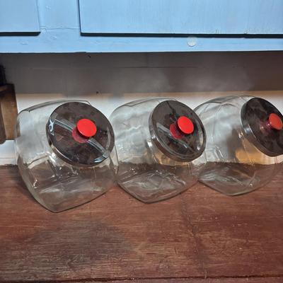 LOT 277-429: Set of Large Clear Glass Tilted Candy/Cookie Jar with Metal Lids & Red Knobs, Southern Living, Betty Crocker Cookbooks...