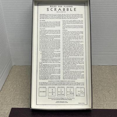 Sale Photo Thumbnail #55: Challenge your vocabulary with this Vintage Scrabble Deluxe Edition, complete with a classic folding game board, full set of wooden letter tiles, four wooden racks, and a convenient storage tray.