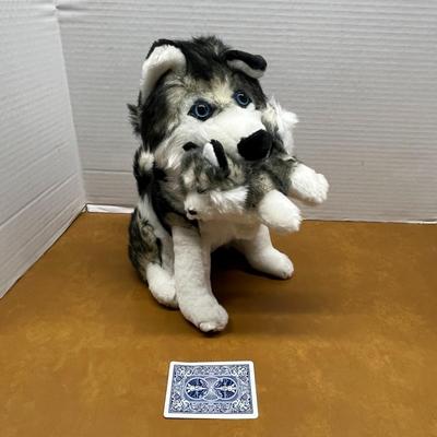 Sale Photo Thumbnail #1426: Adorable and heartwarming, this husky plush toy features a mother dog cuddling her puppy, all made from ultra-soft material with lifelike detailing and bright blue eyes.