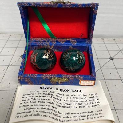 Sale Photo Thumbnail #1699: Traditional Chinese Baoding balls with sound chimes, housed in a decorative fabric box, include instruction pamphlet for relaxation and finger dexterity therapy.