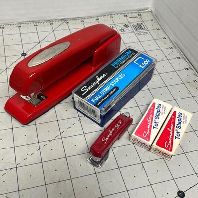 Sale Photo Thumbnail #1709: Assorted classic office items including staplers, scissors, ruler, tape, and mini dictionary.