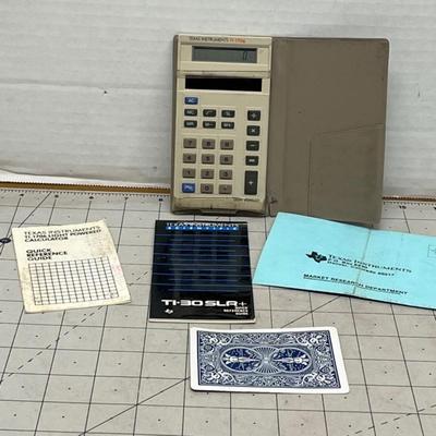 Sale Photo Thumbnail #1734: Classic TI-1706 calculator with original TI-30 SLR+ quick reference guide included.