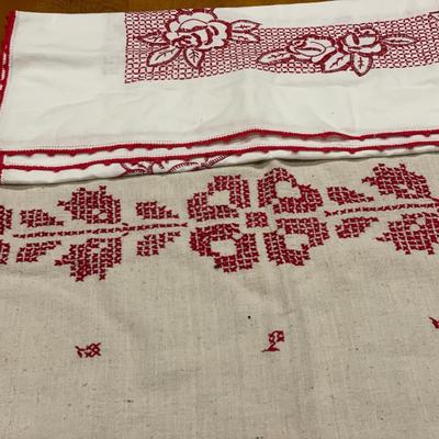 Ceramic wall plaque & red embroidered table cloths