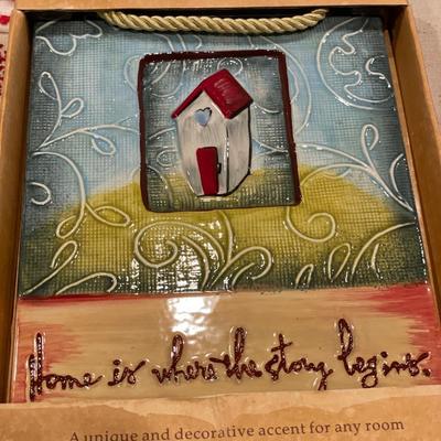 Ceramic wall plaque & red embroidered table cloths
