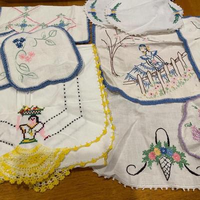 Embroidered ladies and other doilies