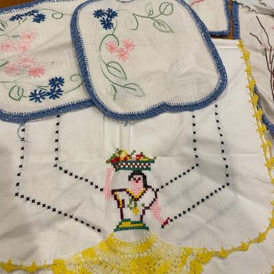 Embroidered ladies and other doilies