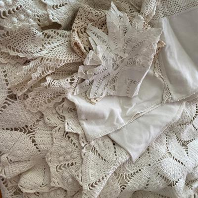Cream crochet bedspread with doilies and runner