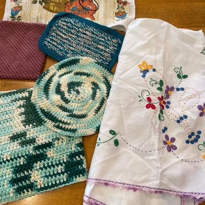 Knitted pot holders, embroidered table cloths and dish cloth