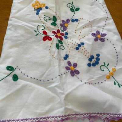 Knitted pot holders, embroidered table cloths and dish cloth