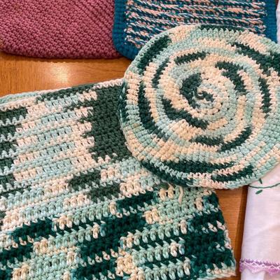 Knitted pot holders, embroidered table cloths and dish cloth