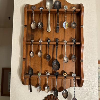 SOUVENIR SPOONS IN WOODEN RACKS
