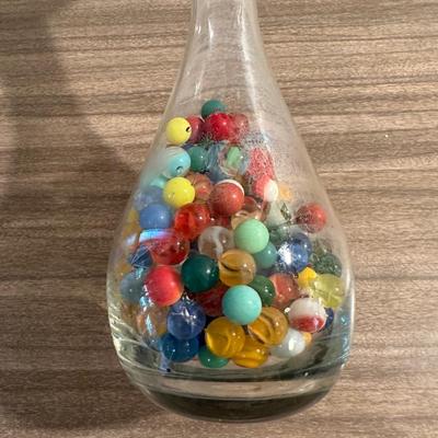 VINTAGE MARBLES IN AN ETCHED DECANTER