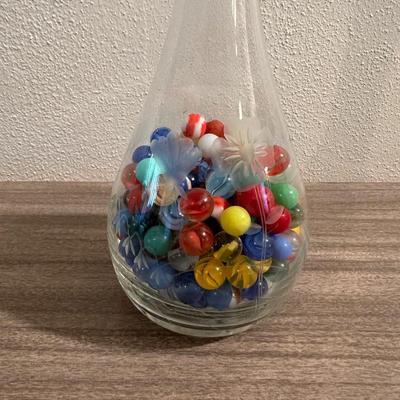 VINTAGE MARBLES IN AN ETCHED DECANTER