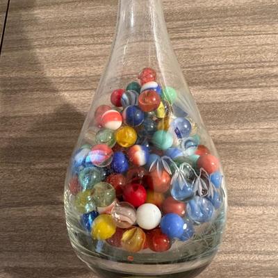 VINTAGE MARBLES IN AN ETCHED DECANTER