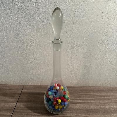 VINTAGE MARBLES IN AN ETCHED DECANTER