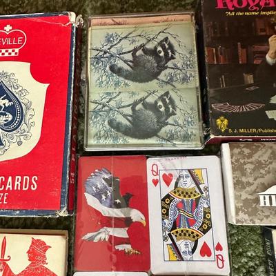 DECKS OF CARDS INCLUDING ONE HUGE DECK PLUS A BOOK ON TRICKS AND STUNTS WITH PLAYING CARDS
