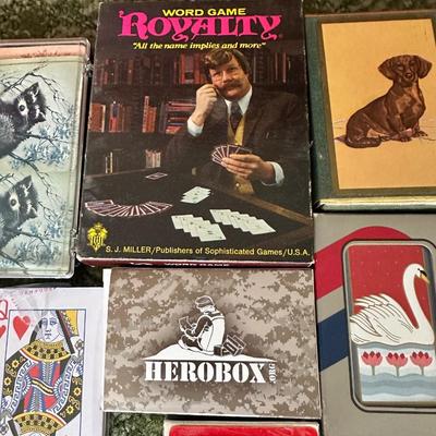 DECKS OF CARDS INCLUDING ONE HUGE DECK PLUS A BOOK ON TRICKS AND STUNTS WITH PLAYING CARDS