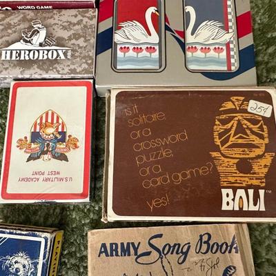 DECKS OF CARDS INCLUDING ONE HUGE DECK PLUS A BOOK ON TRICKS AND STUNTS WITH PLAYING CARDS