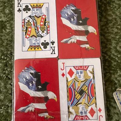 DECKS OF CARDS INCLUDING ONE HUGE DECK PLUS A BOOK ON TRICKS AND STUNTS WITH PLAYING CARDS