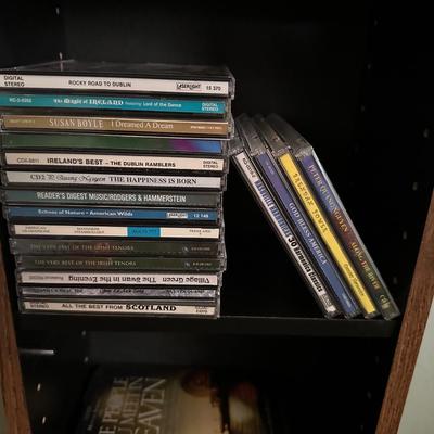 MUSIC ON CD AND A CD HOLDER