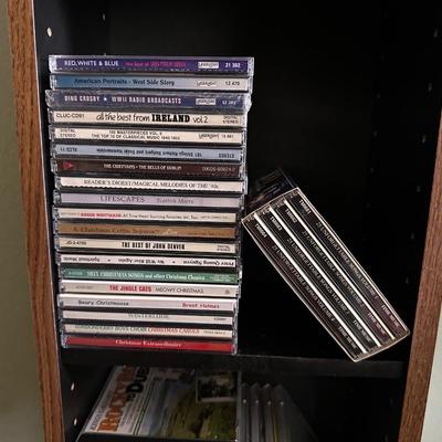 MUSIC ON CD AND A CD HOLDER