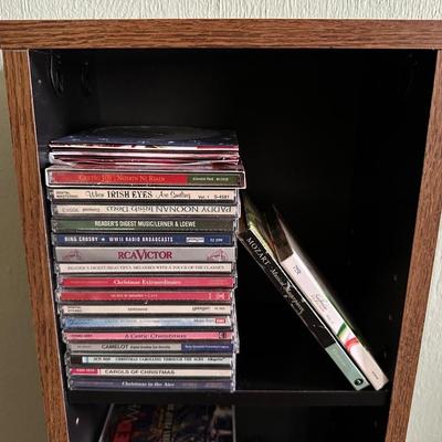 MUSIC ON CD AND A CD HOLDER