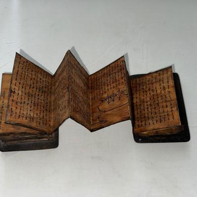 Sale Photo Thumbnail #221: Accordion style book made of Wood Covers and Bark pages. Writing is on both sides