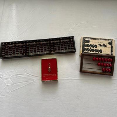 24-KT GOLD PLATED SOOTHE SPINNER (FORTUNE TELLING ARTIFACT) THE ADULT GAME "THINK" AND AN ABACUS