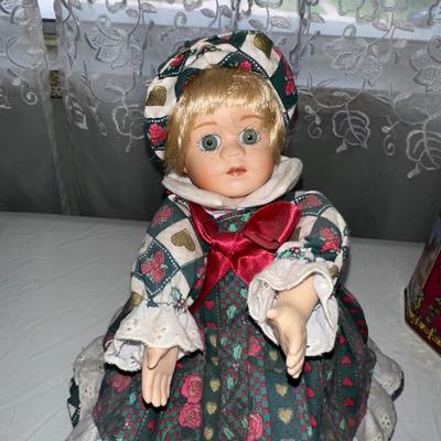 MUSICAL LITTLE BROWN JUG, DOLL AND METAL TIN