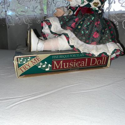 Sale Photo Thumbnail #758: Musical Doll sits 9” Tall