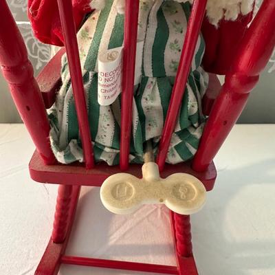 THREE SMALLER DOLLS PLUS A WICKER DOLL CHAIR