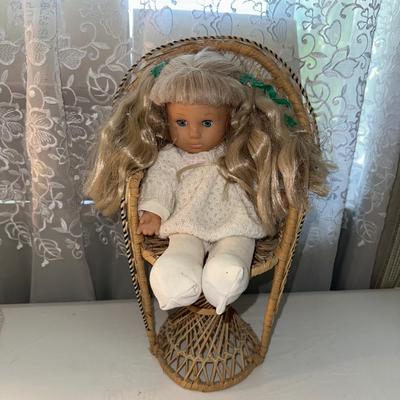 3 SMALLER DOLLS PLUS A WICKER DOLL CHAIR