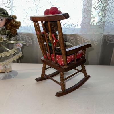 SMALL VINTAGE DOLLS AND A WOODEN ROCKING CHAIR