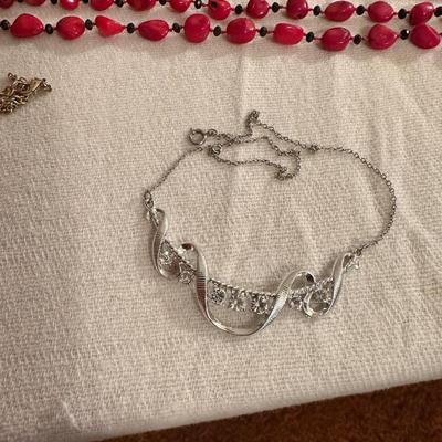 A VARIETY OF COSTUME JEWELRY