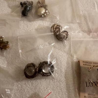 AN ASSORTMENT OF COSTUME CLIP ON EARRINGS