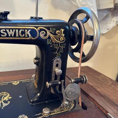 BRUNSWICK TREADLE SEWING MACHINE IN CABINET