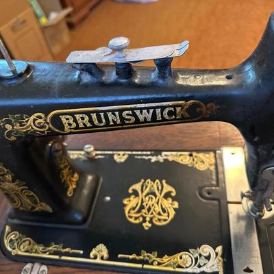 BRUNSWICK TREADLE SEWING MACHINE IN CABINET