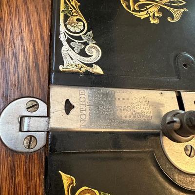 BRUNSWICK TREADLE SEWING MACHINE IN CABINET