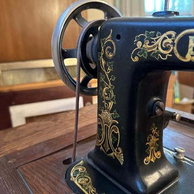 BRUNSWICK TREADLE SEWING MACHINE IN CABINET