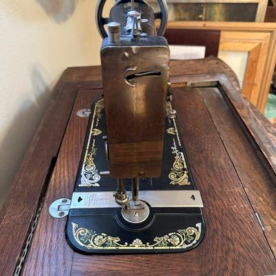 BRUNSWICK TREADLE SEWING MACHINE IN CABINET
